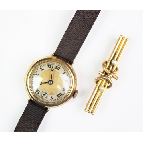 136 - A 9ct gold wristwatch, with Roman numeral dial and subsidiary seconds dial, to a woven brown strap, ... 