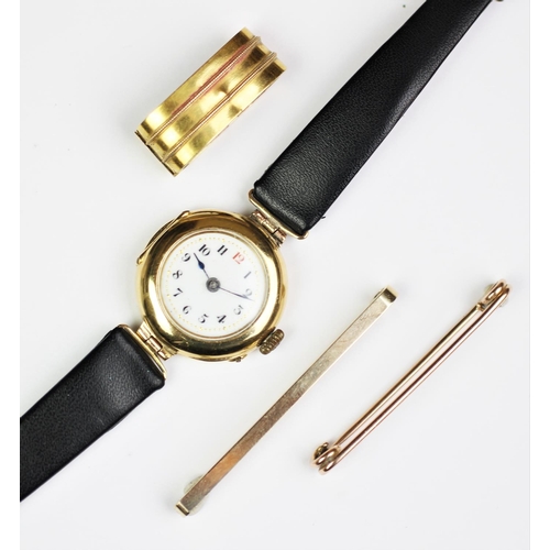 203 - A selection of gold coloured jewellery, comprising; an 18ct gold ladies wristwatch, two stock pins o... 