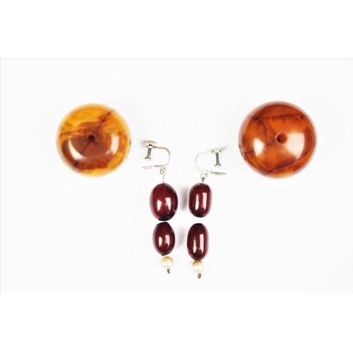 222 - A 'Cherry' amber single strand bead necklace, the forty seven graduated beads, (largest measuring 2.... 