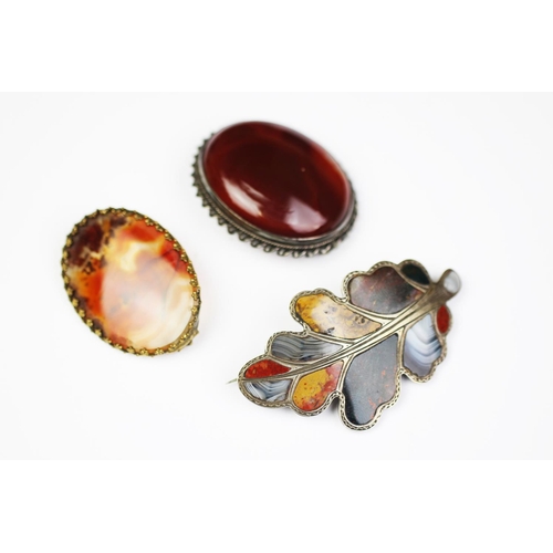 231 - A Scottish agate set brooch, of oak leaf form, 6.5cm long, with two further agate brooches, 50.6gms ... 