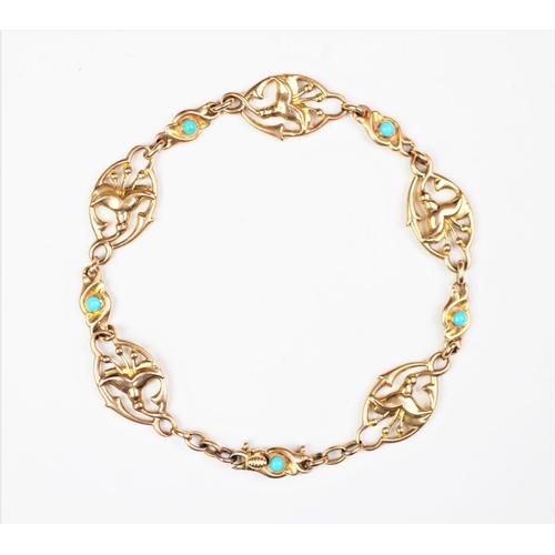 243 - A Victorian turquoise set bracelet, designed as five oval links depicting lilies, interspersed with ... 