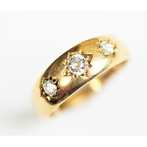 279 - A three stone diamond ring, early 20th century, the three graduated old brilliant cut diamonds, all ... 