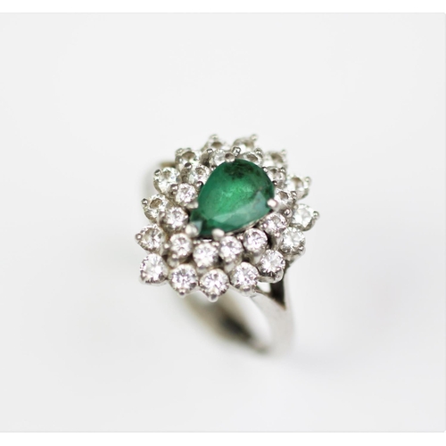 281 - An emerald and diamond set cluster ring, designed as a central claw set, pear shaped emerald, surrou... 