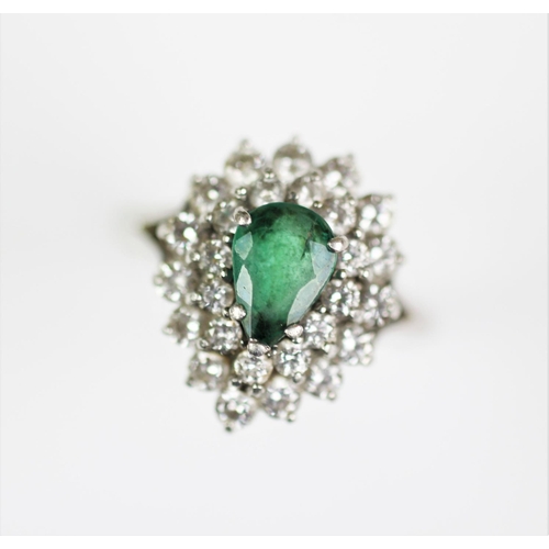 281 - An emerald and diamond set cluster ring, designed as a central claw set, pear shaped emerald, surrou... 