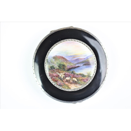 78 - An Art Deco enamelled compact, import mark for Stockwell & Co, London 1929, the circular compact fin... 