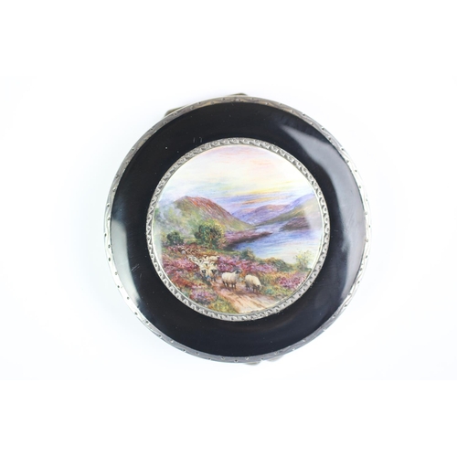 78 - An Art Deco enamelled compact, import mark for Stockwell & Co, London 1929, the circular compact fin... 