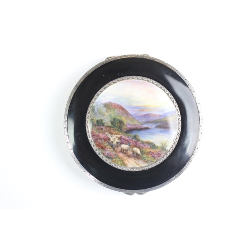 78 - An Art Deco enamelled compact, import mark for Stockwell & Co, London 1929, the circular compact fin... 