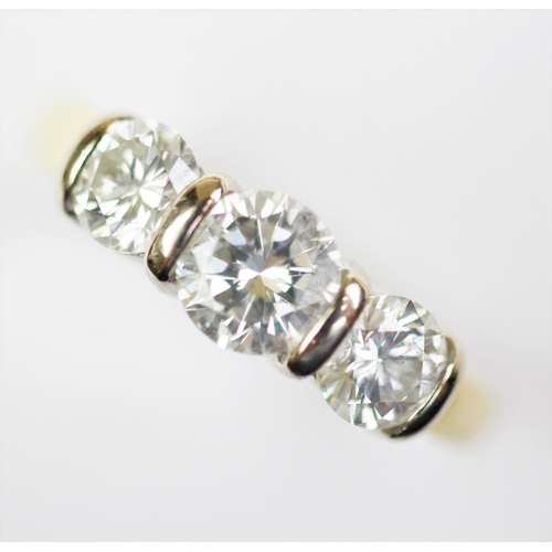 271 - A three stone diamond ring, the three graduated brilliant cut diamonds all set in white metal, to th... 