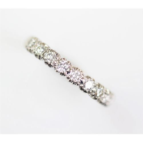 291 - A diamond set half eternity ring, London 1984, designed as nine uniform brilliant cut diamonds, all ... 