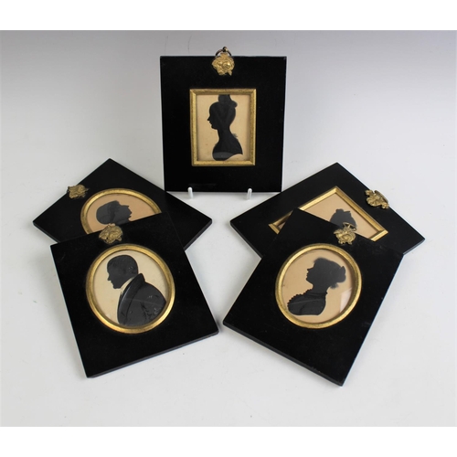 325 - Five 19th century portrait silhouette miniatures, each mounted under glass in ebonised wooden frames... 