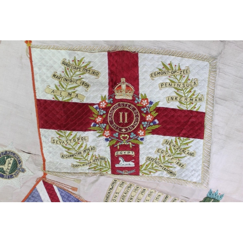 337 - A First World War Manchester Regiment silkwork panel, detailed with a Union Jack flag and the St Geo... 