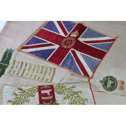 337 - A First World War Manchester Regiment silkwork panel, detailed with a Union Jack flag and the St Geo... 