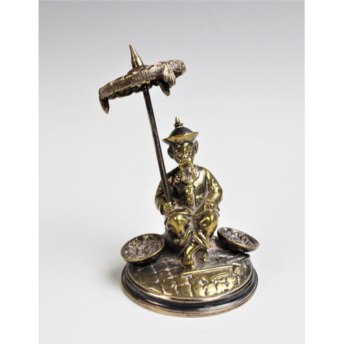 93 - A late 19th century silver plated hat pin stand, Cailar, Bayard & Cie, modelled as a seated oriental... 