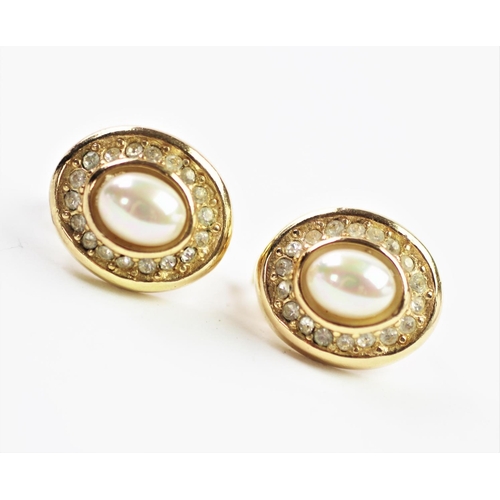 212 - A pair of Christian Dior clip earrings, designed as an oval cluster of imitation pearl and colourles... 