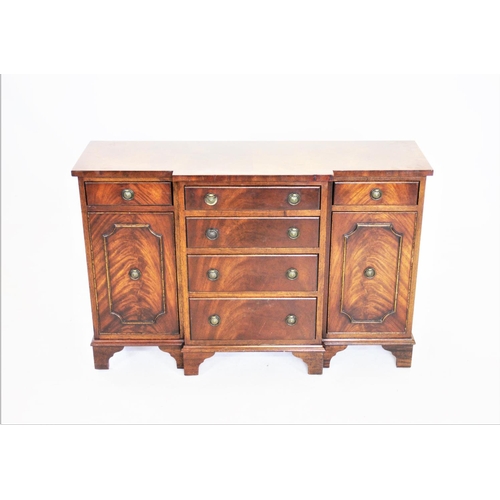 960 - A Reprodux mahogany breakfront sideboard, of small proportions, the central four graduated drawers f... 