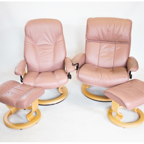 964 - Two Ekornes stressless reclining leather armchairs, each on a circular beech wood base with conformi... 