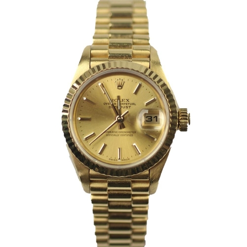 142 - A lady's 18ct yellow gold Rolex Oyster perpetual date-just wristwatch, the circular face with fluted... 