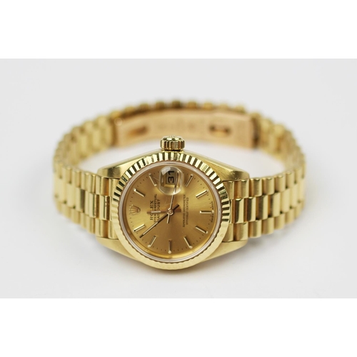 142 - A lady's 18ct yellow gold Rolex Oyster perpetual date-just wristwatch, the circular face with fluted... 