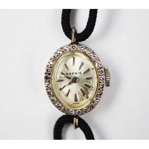 161 - A 14ct gold and diamond Benrus cocktail watch, the oval dial with diamond set bezel, enclosing silve... 