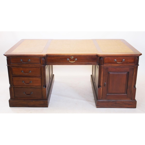 945 - A George III style mahogany partners desk, 20th century, the inverted desk top with three inset leat... 