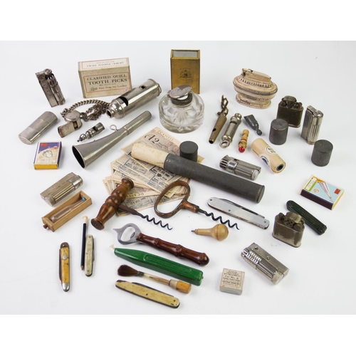 318 - A collection of early 20th century, cigarette lighters, table lighters, pocketknives, whistles, horn... 