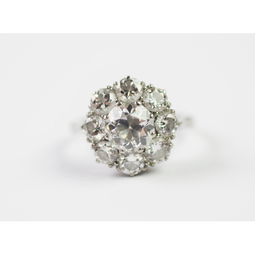 286 - A diamond set cluster ring, early 20th century, designed as a central old brilliant cut, claw set di... 