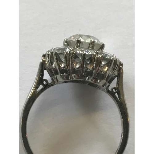 286 - A diamond set cluster ring, early 20th century, designed as a central old brilliant cut, claw set di... 