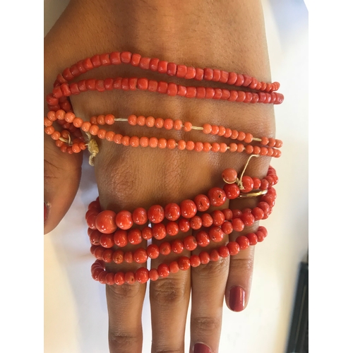 197 - An assorted collection of coral coloured bead necklaces, comprising bead necklaces and a bracelet, g... 