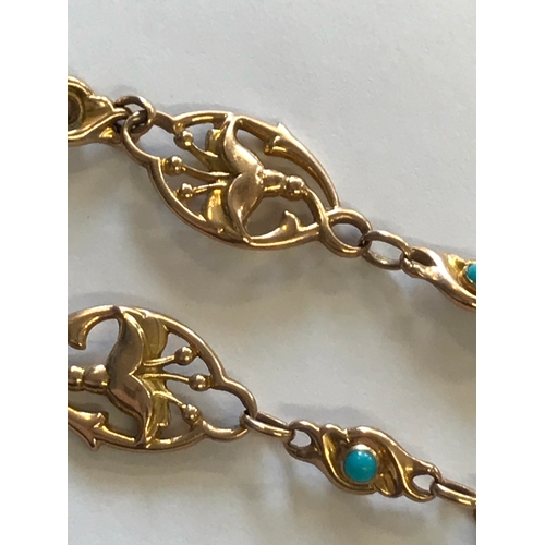 243 - A Victorian turquoise set bracelet, designed as five oval links depicting lilies, interspersed with ... 