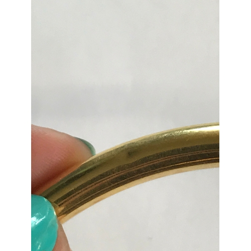 257 - A 9ct yellow gold slave bangle, 10cm diameter, weight 16.8gms, along with another similar example of... 