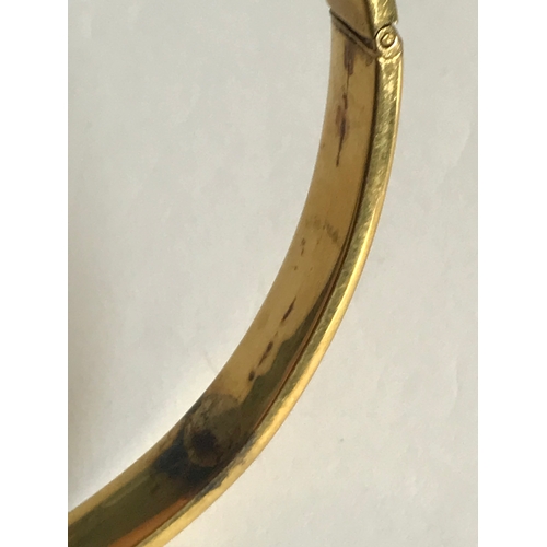 257 - A 9ct yellow gold slave bangle, 10cm diameter, weight 16.8gms, along with another similar example of... 