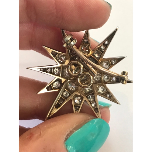 192 - A Victorian diamond set star brooch/pendant, originally from a tiara, the twelve point star, set thr... 