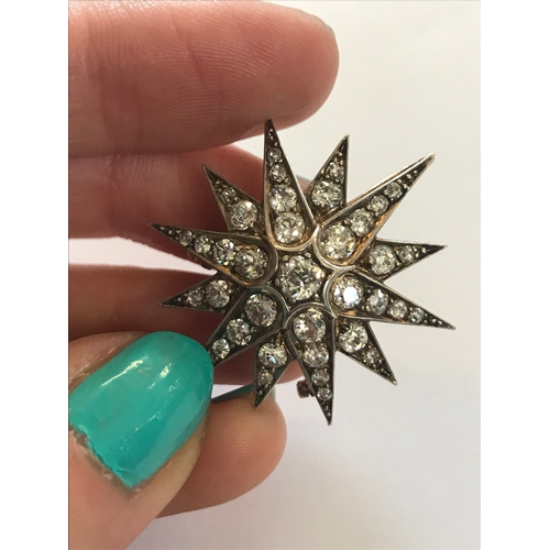 192 - A Victorian diamond set star brooch/pendant, originally from a tiara, the twelve point star, set thr... 