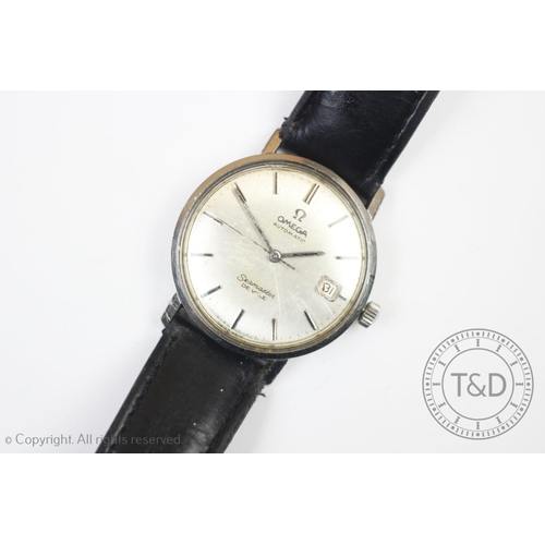 103 - A gentleman's Omega De Ville Seamaster wristwatch, the silvered face with baton markers and date ape... 