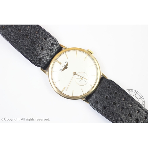 106 - A Longines 9ct gold wristwatch, the circular white dial with gold toned baton markers and subsidiary... 