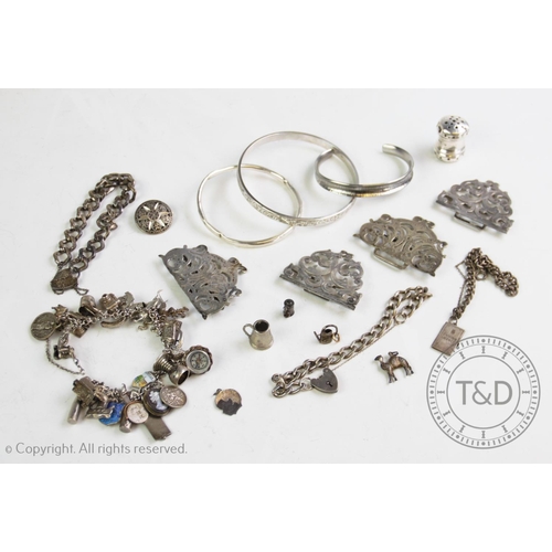12 - An assortment of lady’s silver and white metal accessories, to include, a silver nurses belt buckle ... 