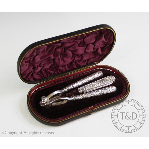 20 - A Victorian silver nutcracker and fruit knife, Hilliard & Thomason, Birmingham 1888-1889, with folia... 