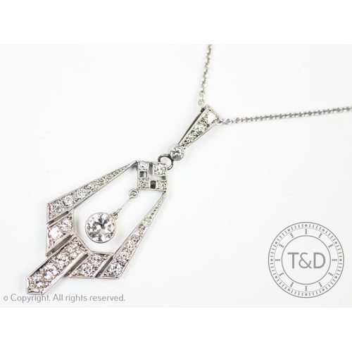 211 - An Art Deco diamond set pendant, the tapered angular, openwork pendant set with graduated eight-cut ... 