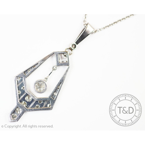 211 - An Art Deco diamond set pendant, the tapered angular, openwork pendant set with graduated eight-cut ... 