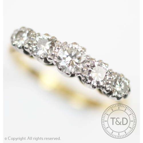 235 - A five stone diamond ring, the five graduated brilliant cut diamonds, each claw set in white metal t... 