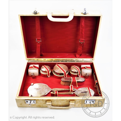 24 - A 20th century silver topped harlequin dressing set, comprising two silver topped perfume bottles an... 