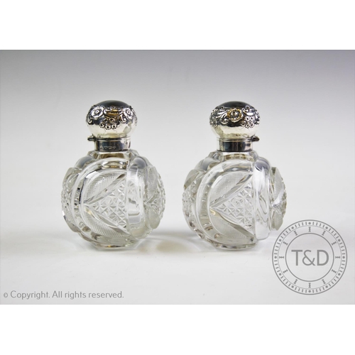 29 - A pair of Victorian silver mounted cut glass scent bottles, John Grinsell & Sons, Birmingham 1900, o... 