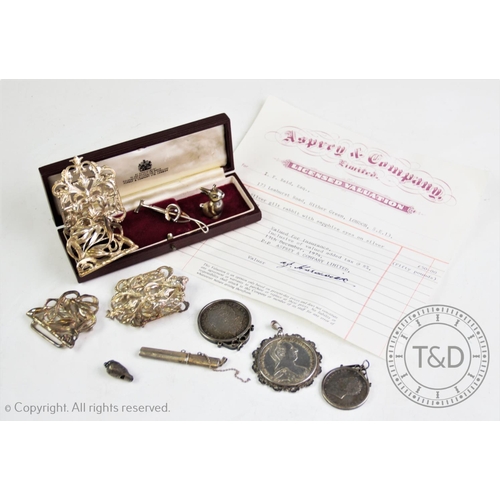 35 - A selection of silver and silver coloured items to include, a silver gilt rabbit charm, London 1992,... 