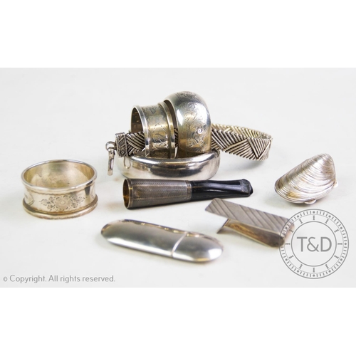40 - A selection of silver and silver coloured items, comprising: a silver hinged bangle, C P S Jewellery... 