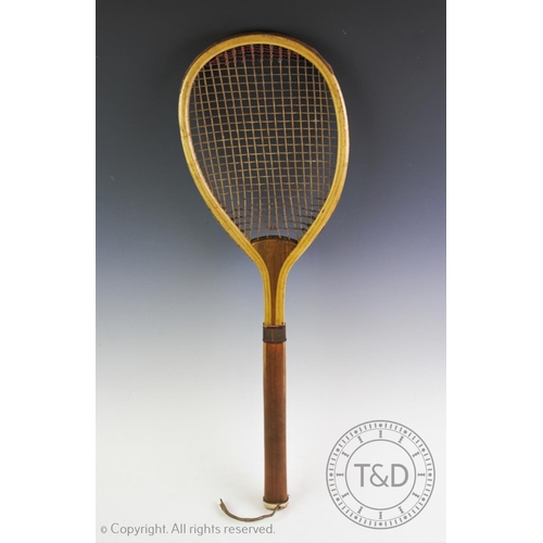 447 - A lawn tennis racket by F.H. Ayres of London circa 1880, with original intact strings the top of the... 