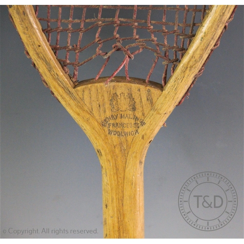 448 - An early tilt head racket by Henry Malings of Frances Street, Woolwich circa 1875, the small head is... 