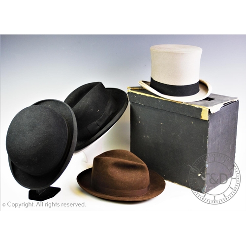 452 - A vintage hat collection, comprising: a Harrod's bowler hat, a Herbert Johnson (Bond Street) Ltd hom... 