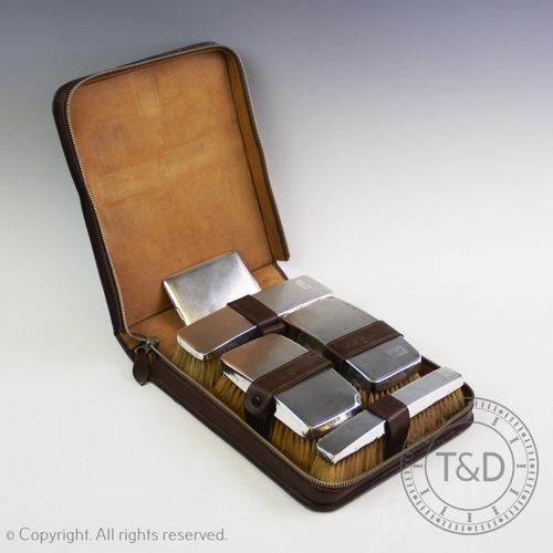 46 - A gentleman's silver backed dressing table set, Barker Brothers Silver Ltd, Birmingham 1935, compris... 