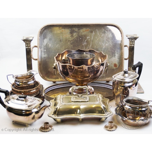 73 - A selection of silver plated wares to include, a pair of Corinthian column candlesticks, on stepped ... 