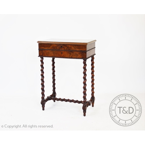 789 - A walnut work table, with rectangular top enclosing an interior with mirror, on barley twist legs, 7... 